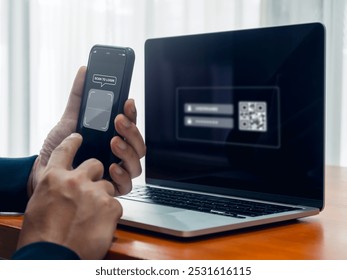 QR Code, multi factor authentication security concept. Digital scanner on smartphone camera lens frame with text, scan for login, holding by businessman hand while scanning on laptop computer screen. - Powered by Shutterstock - Get 15% off with code: PIKWIZARD15