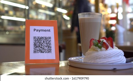 QR code payment is a contactless payment method by scanning a QR code from a mobile app. Customer scans the QR code displayed by the merchant with their smartphone to pay for their goods or a service