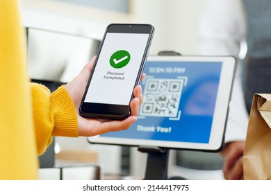 QR code payment, customer using smartphone for paying at shop
