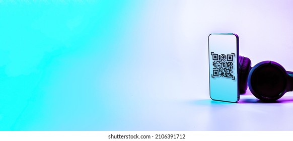 Qr code payment. Digital mobile smart phone with qr code scanner on smartphone screen for pay, scan barcode technology on neon background. Online shopping, cashless society technology concept