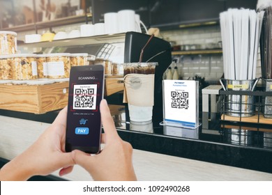 Qr code payment, E wallet , cashless technology concept illustration. Man scanning  tag in Coffee shop accepted generate digital pay without money. - Shutterstock ID 1092490268