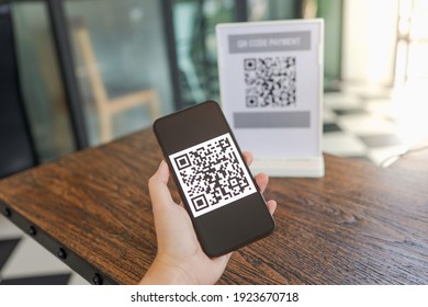 Qr code payment. E wallet. Man scanning tag accepted generate digital pay without money.scanning QR code online shopping cashless technology concept