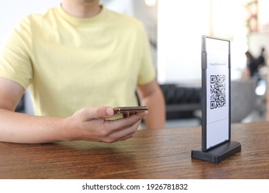 Qr code payment. E wallet. Man scanning tag accepted generate digital pay without money.scanning QR code online shopping cashless technology concept