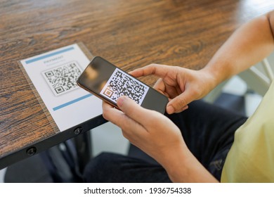 Qr code payment. E wallet. Man scanning tag accepted generate digital pay without money.scanning QR code online shopping cashless technology concept