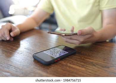 Qr code payment. E wallet. Man scanning tag accepted generate digital pay without money.scanning QR code online shopping cashless technology concept