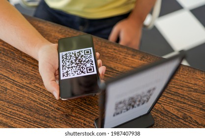 Qr code payment. E wallet. Man scanning tag accepted generate digital pay without money.scanning QR code online shopping cashless technology concept