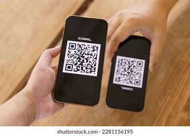Qr code payment. E wallet. Man scanning tag accepted generate digital pay without money.scanning QR code online shopping cashless payment and verification technology concept