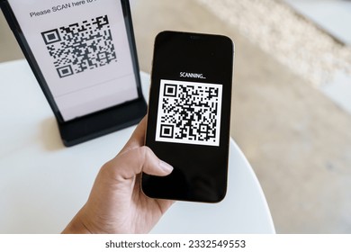 Qr code payment. E wallet. Man scanning tag accepted generate digital pay without money.scanning QR code online shopping cashless payment and verification technology concept