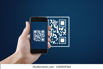 QR code scanning payment and verification. Hand using mobile smart phone scan QR code - Shutterstock ID 1569659563