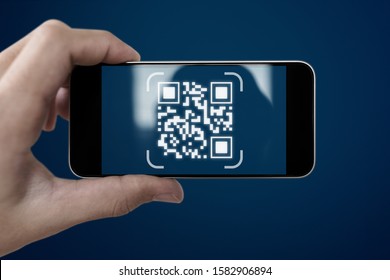 QR code scanning payment and verification. Hand using mobile smart phone scan QR code - Powered by Shutterstock - Get 15% off with code: PIKWIZARD15