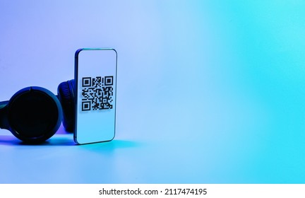Qr code technology. Mobile smartphone screen for payment, online pay, scan barcode technology with qr code scanner on digital smart phone on neon background. Mobile phone application to scan code
