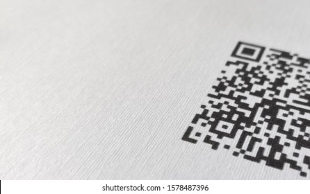 QR code with white background printed on piece of paper