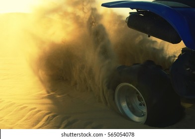 Quad Bike riding in the desert - Shutterstock ID 565054078
