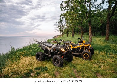 quad bikes in nature. forest summer water. headlights and wheels