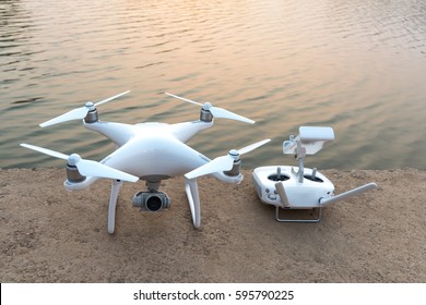 Quad copter or Drone with remote control near river