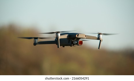 Quadcopter with a camera in flight. Technique for aerial photography