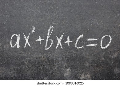 A Quadratic Equation Written In Chalk On The Pavement
