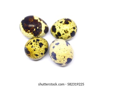 the quail eggs in closeup on white blackgrounds - Shutterstock ID 582319225