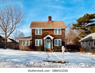 A Quaint Home On A Snow-covered Street In Long Island. Greenport, NY