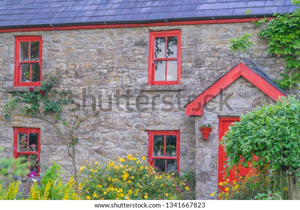 Quaint House Red Door Windows Overgrown Stock Photo Edit Now