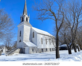 A quaint little country church in the middle of a small town - Powered by Shutterstock