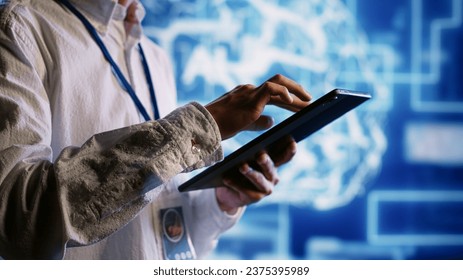Qualified admin works with artificial intelligence computerized model simulating human brain. Proficient expert looks at AI visualization showing machine learning algorithms using pattern recognition