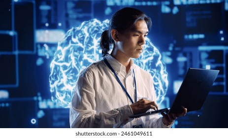 Qualified IT consultant in data center uses artificial intelligence computing simulating human brain thought processes. Licensed professional works on laptop with AI machine learning algorithms