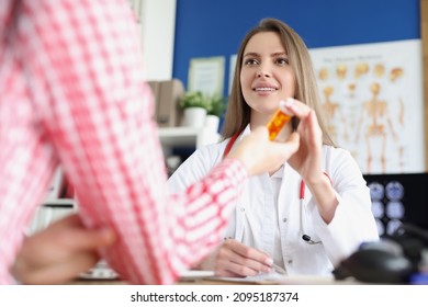 Qualified Female Doctor Give Medications In Bottle To Patient For Faster Recovery