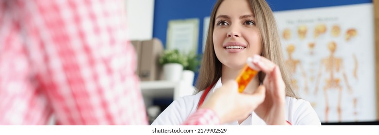 Qualified Female Doctor Give Medications In Bottle To Patient For Faster Recovery