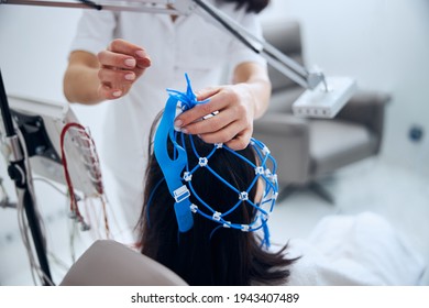 Qualified Female Technician Finishing The EEG Test