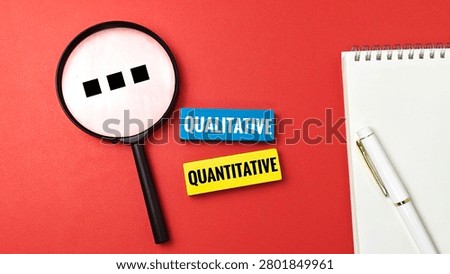 Qualitative and Quantitative Research Method Concept with Magnifying Glass on Red Background for Data Analysis Statistics Information Study. 