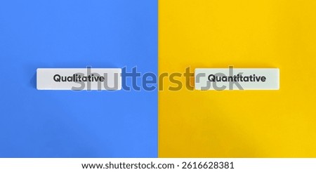 Qualitative versus Quantitative Banner. Text on Block Letter Tiles on Yellow and Blue Background. Minimal Aesthetic.