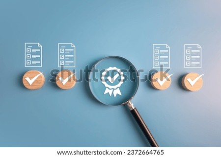 Quality assurance checklist, ISO standard, best quality score and product warranty concept.wooden block and magnifier with business icons.