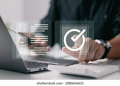 Quality control certification assures that the company's product satisfies its specifications. There is a concept on the virtual screen. - Shutterstock ID 2080656631