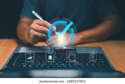 Quality control, Certification and standardization process concept. Man holding the pen and point to checked icon on screen. Validation for business. Product and service warranty. ISO certification.