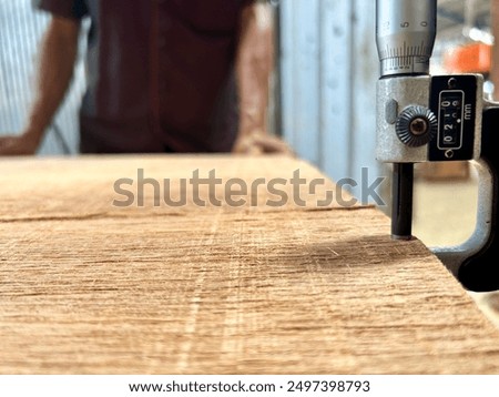 Quality Control checking the thickness of a Veneer sheet