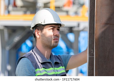 Quality control engineer is checking to steel welded manufactures. Quality control (QC) is a process by which entities review the quality of all factors involved in production.