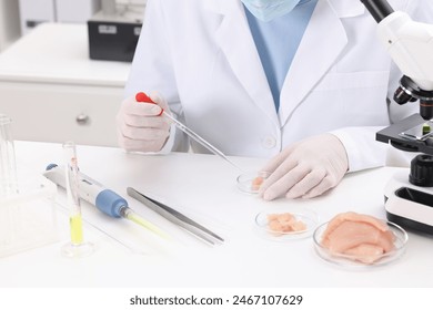 Quality control. Food inspector examining meat in laboratory, closeup - Powered by Shutterstock