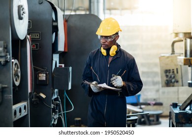 Quality Control Inspector Checking Workers At Factory. Engineering Worker Team Working In Heavy Industry Manufacturing Facility. Engineer Operating Lathe Machinery. American African People.