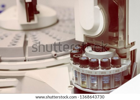 Quality Control Laboratory medicine by equipment. Vials on autosampler of gas chromatography-mass spectrophotometer.