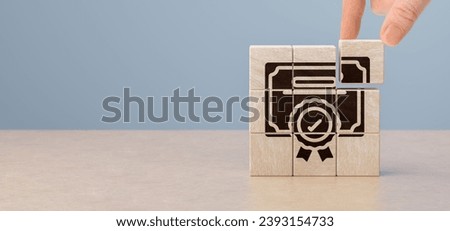 Quality control management, ISO certification, service quality warranty concept. hand puts wooden cubes with quality warranty icon. banner and advertising product and service quality commitment.