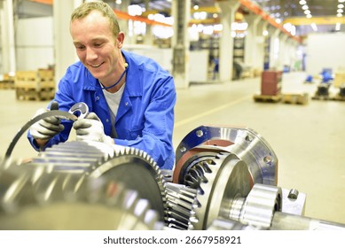 quality control in mechanical engineering - engineer controls dimensions with a caliper gauge for tolerances and accuracy 
