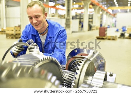 quality control in mechanical engineering - engineer controls dimensions with a caliper gauge for tolerances and accuracy 