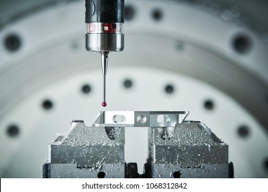 Quality control on milling CNC machine. Precision probe sensor at industrial metalworking