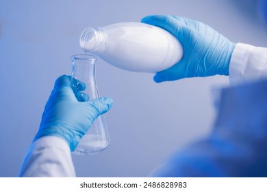 Quality control test of milk in laboratory. Dairy factory industry products. - Powered by Shutterstock