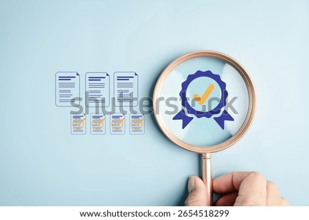 Quality document check verification process with a magnifying glass focusing on approved documents and certification symbol, illustrating inspection, audit, and compliance concept.