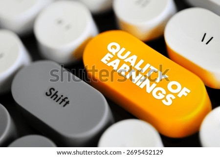 Quality of Earnings - ability of reported earnings to predict a company's future earnings, text concept button on keyboard