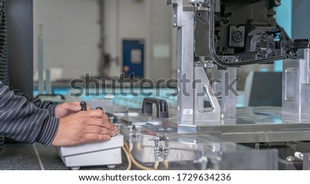 quality engineer controls an instrument for 3D measurement of plastic castings in the automotive industry