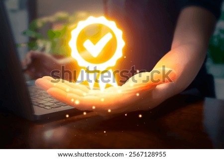 Quality guarantee process and satisfaction concept. Businessman using laptop and showing the sign of the top service Quality assurance in Black background , Guarantee, Standards, ISO certification.