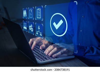 Quality management with QA (assurance), QC (control) and improvement. Standardization and certification concept. Compliance to regulations and standards. Manager or auditor working on computer. - Shutterstock ID 2084738191
